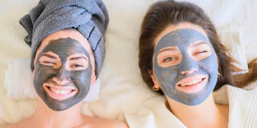 top-view-women-relaxing-home-with-face-masks